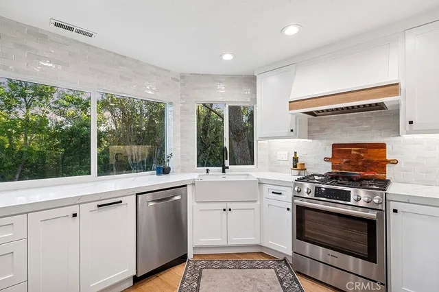 a kitchen with a stove and a sink