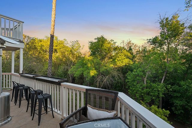 a view of balcony with furniture