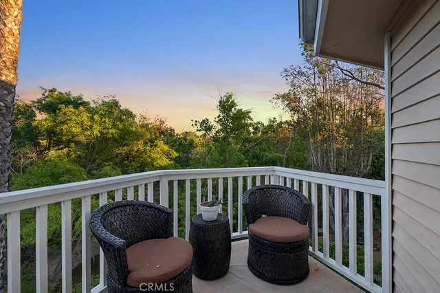 a view of a chair and fire pit in the balcony