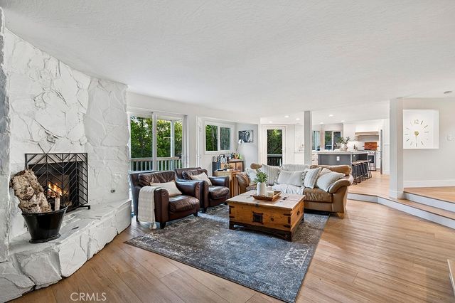 a living room with furniture rug and window