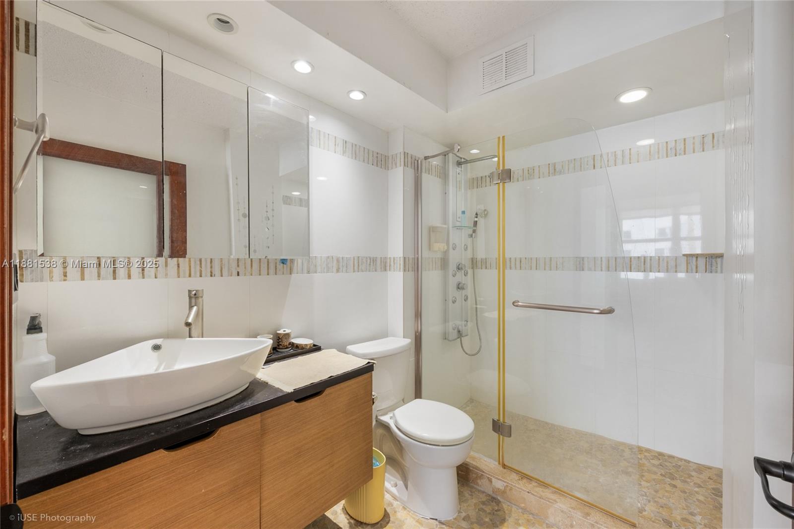 1901 South Ocean Drive, Unit 303 Hollywood, FL 33019 - Photo 16 of 29 a bathroom with a sink toilet and shower