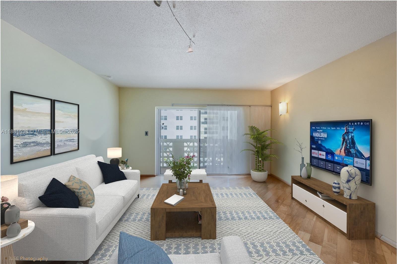 1901 South Ocean Drive, Unit 303 Hollywood, FL 33019 - Photo 18 of 29 a living room with furniture and a large window
