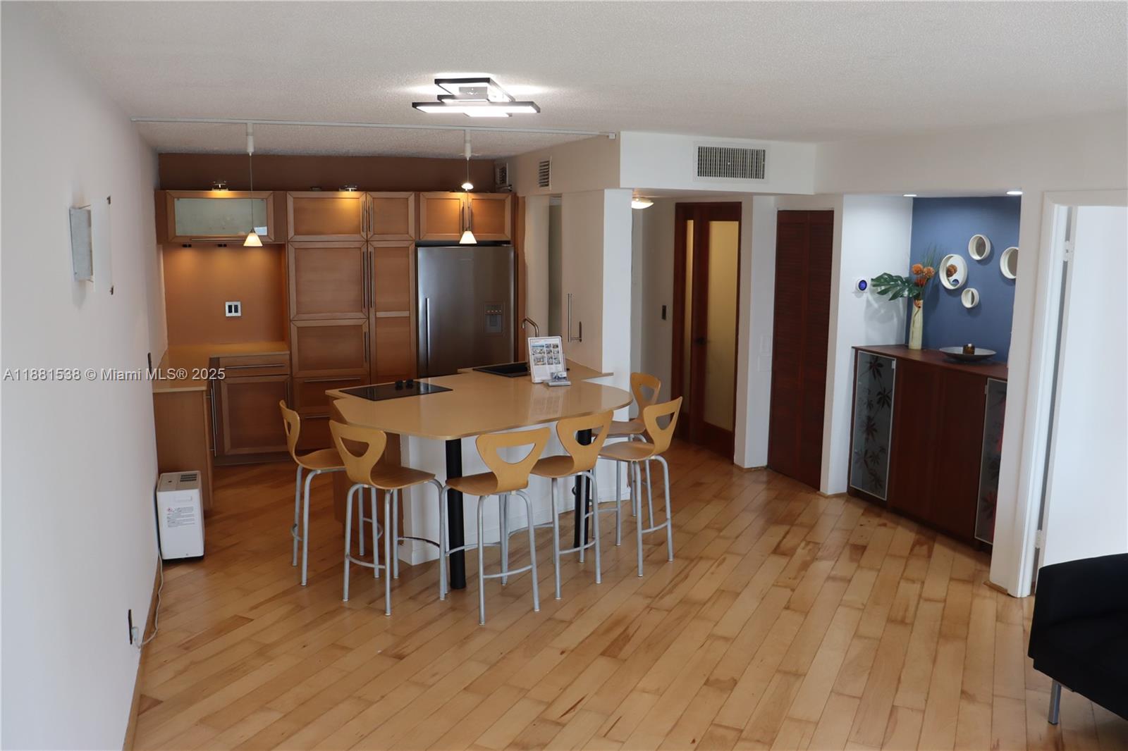 1901 South Ocean Drive, Unit 303 Hollywood, FL 33019 - Photo 20 of 29 a view of a dining room with furniture and wooden floor