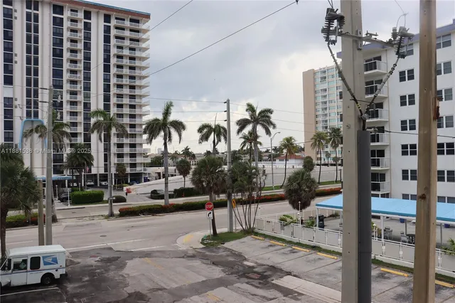 a view of a street with houses on the side