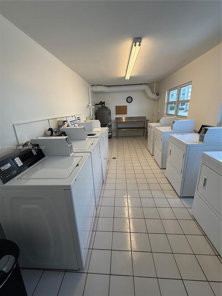 1901 South Ocean Drive, Unit 303 Hollywood, FL 33019 - Photo 29 of 29 a kitchen with a sink a stove and cabinets