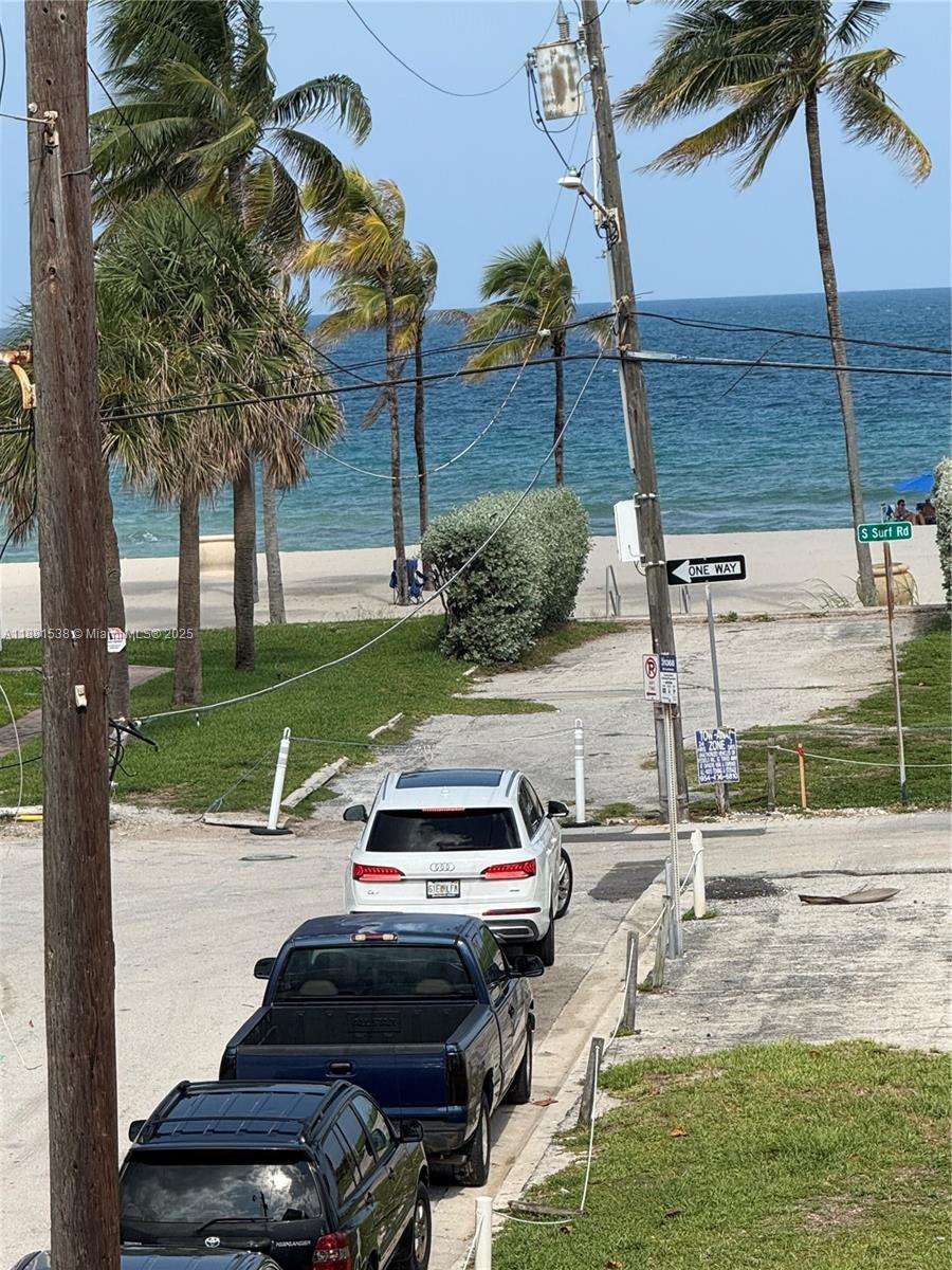 1901 South Ocean Drive, Unit 303 Hollywood, FL 33019 - Photo 9 of 29 a view of a yard with cars