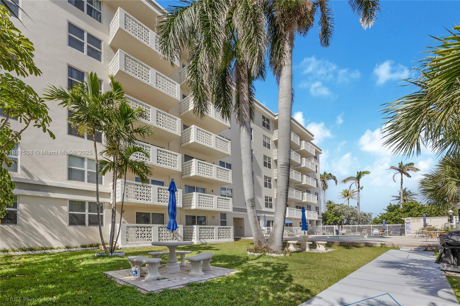 1901 South Ocean Drive, Unit 303 Hollywood, FL 33019 - Photo 10 of 29 a building with trees in front of it