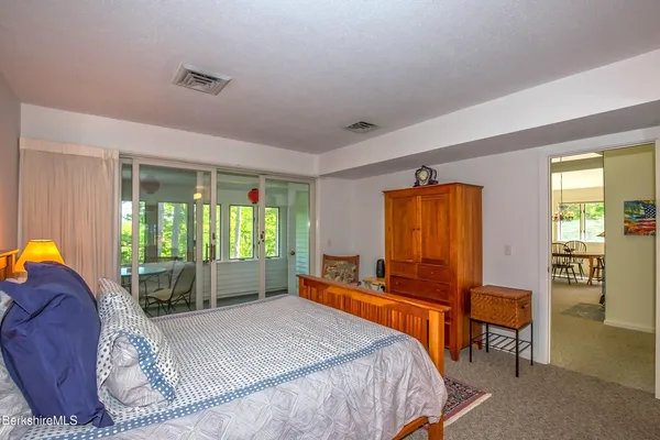 a bed room with a bed and a window