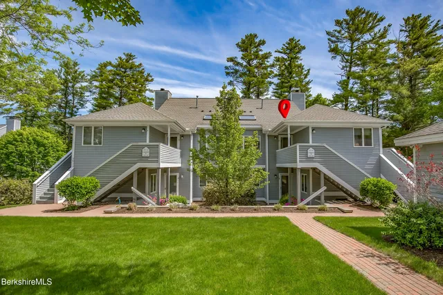 a front view of a house with yard