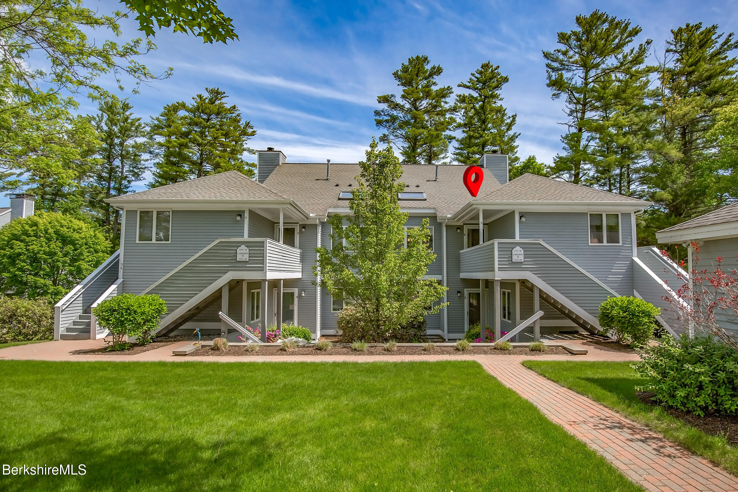 770 Summer Street, Unit 5D Lee, MA 01240 - Photo 2 of 45 a front view of a house with yard