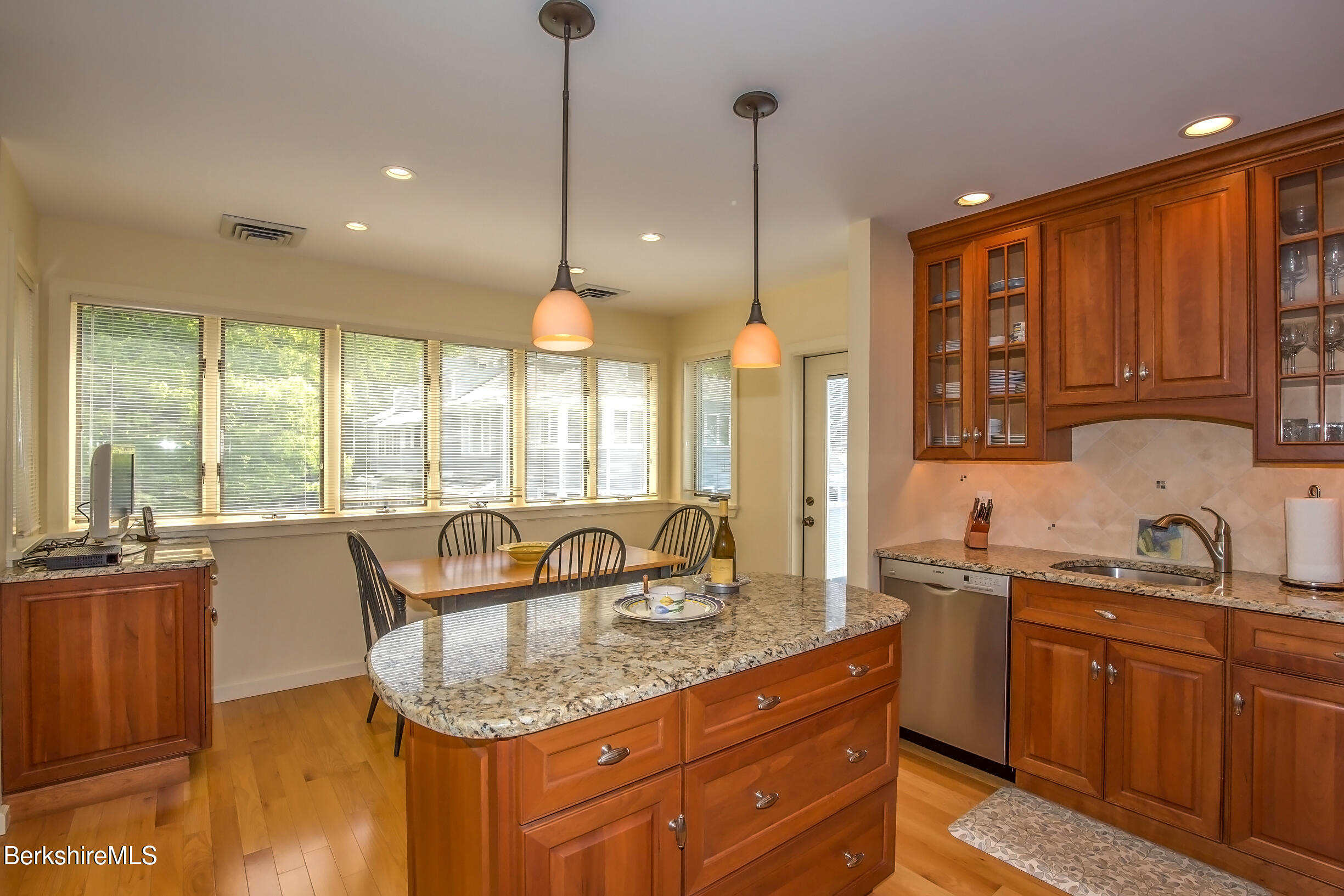 770 Summer Street, Unit 5D Lee, MA 01240 - Photo 28 of 45 a kitchen with granite countertop a sink a counter space appliances and cabinets