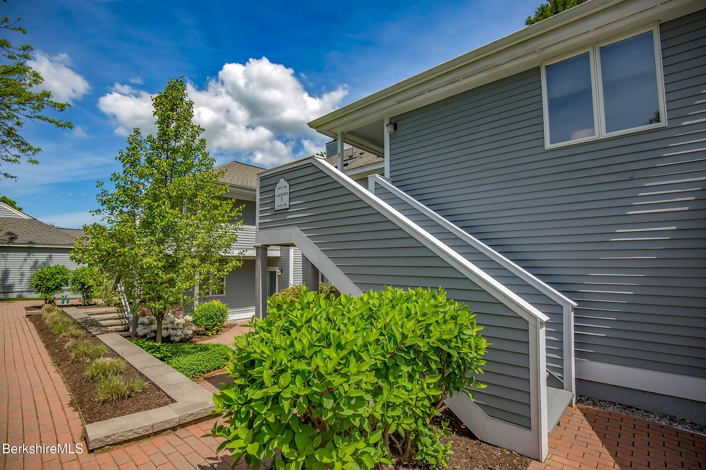 770 Summer Street, Unit 5D Lee, MA 01240 - Photo 3 of 45 a view of a house with a yard