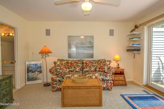 a bed sitting in a room next to a window