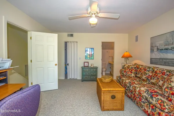 a bedroom with furniture and a chandelier