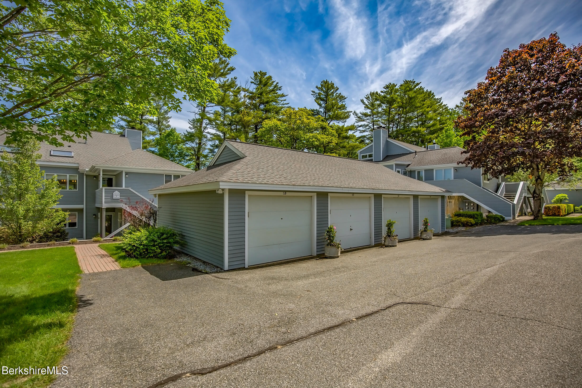 770 Summer Street, Unit 5D Lee, MA 01240 - Photo 42 of 45 a front view of a house with a garden