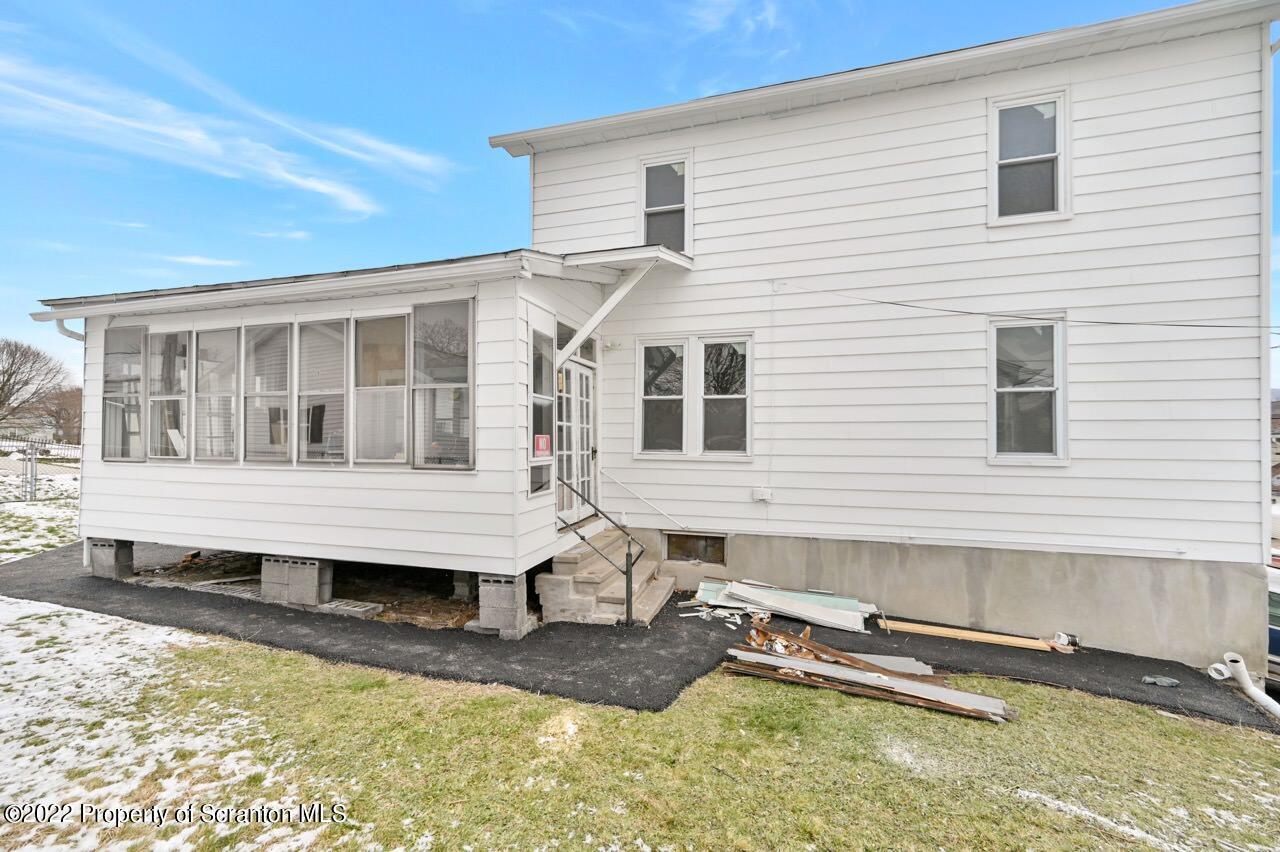 115 West High Street Taylor, PA 18517 - Photo 2 of 38 a view of a house with a wooden deck