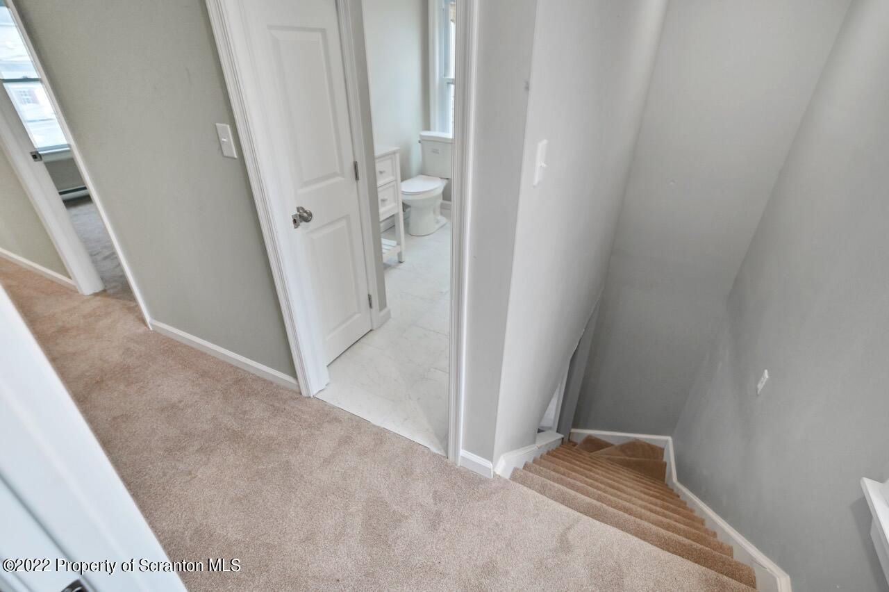 115 West High Street Taylor, PA 18517 - Photo 21 of 38 a view of an empty room