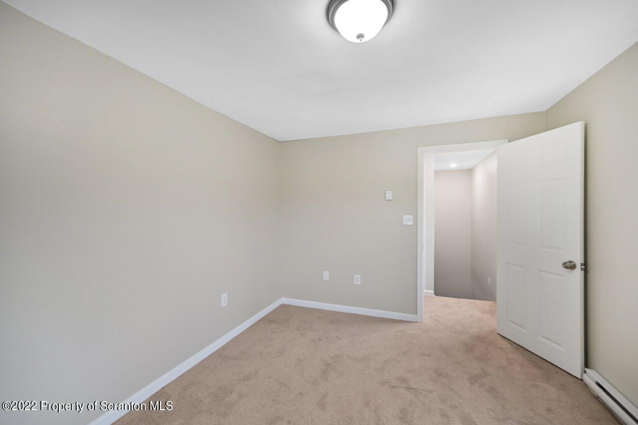 115 West High Street Taylor, PA 18517 - Photo 25 of 38 a view of an empty room