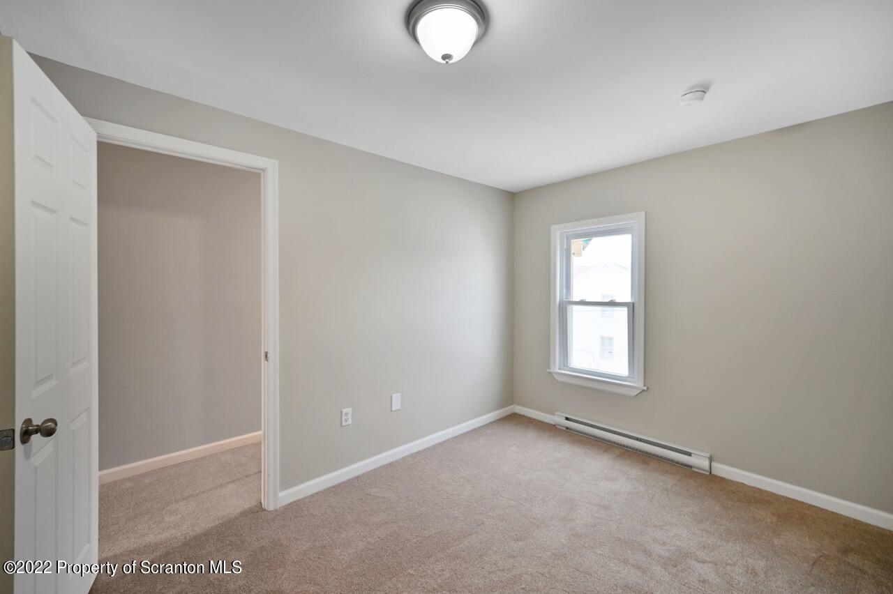 115 West High Street Taylor, PA 18517 - Photo 30 of 38 an empty room with windows and closet