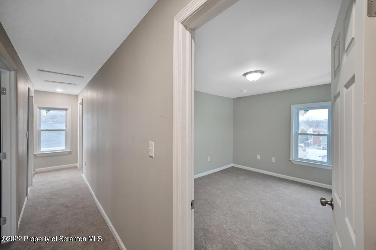 115 West High Street Taylor, PA 18517 - Photo 31 of 38 a view of an empty room with a window