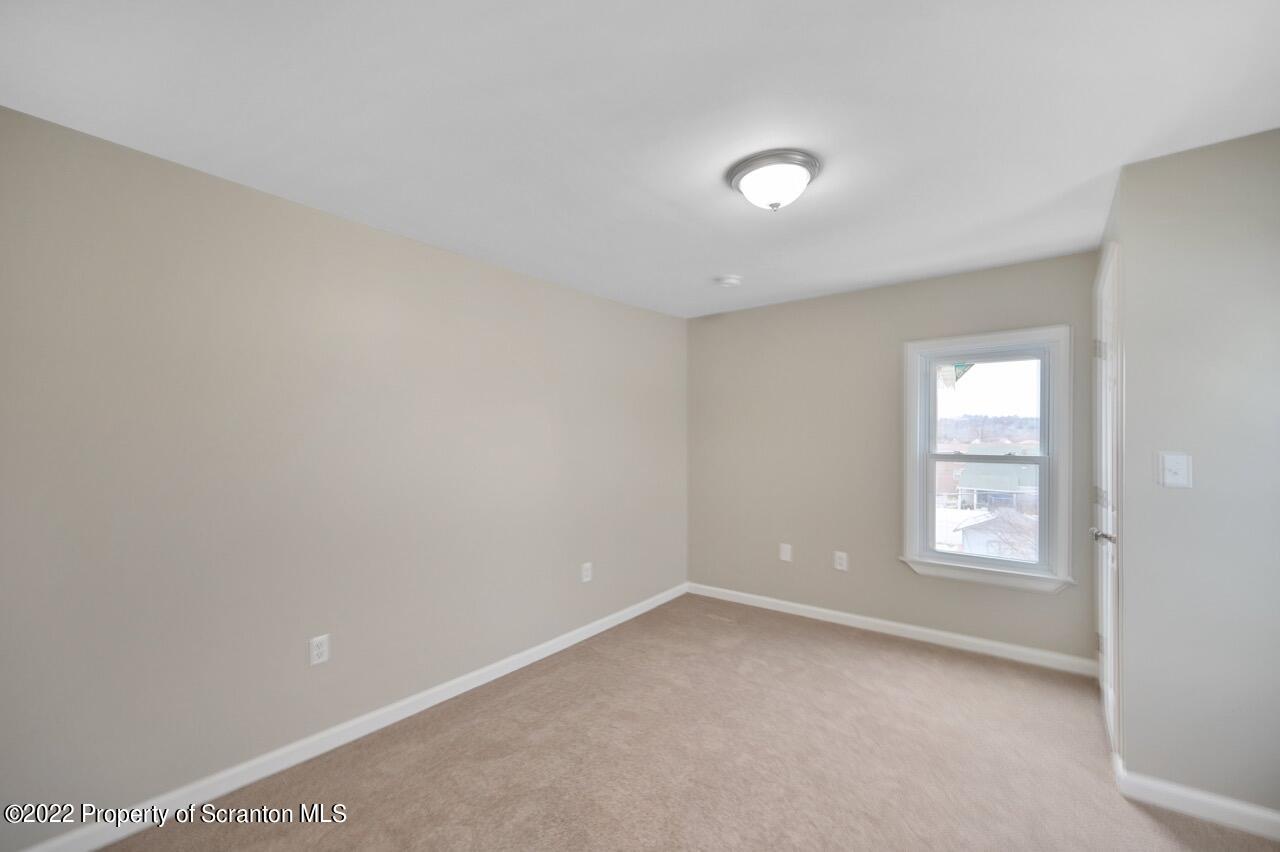 115 West High Street Taylor, PA 18517 - Photo 32 of 38 an empty room with windows