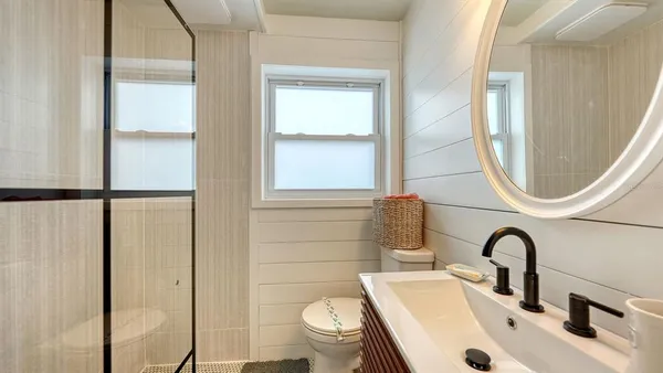 a vase of flowers sitting on a floor