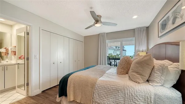 a spacious bedroom with a bed and a couch