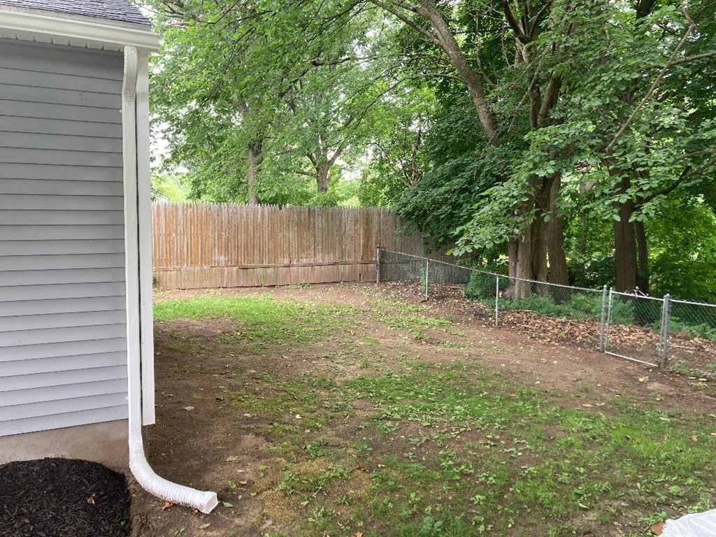 76 Darling Street Springfield, MA 01151 - Photo 4 of 14 a backyard of a house with lots of green space