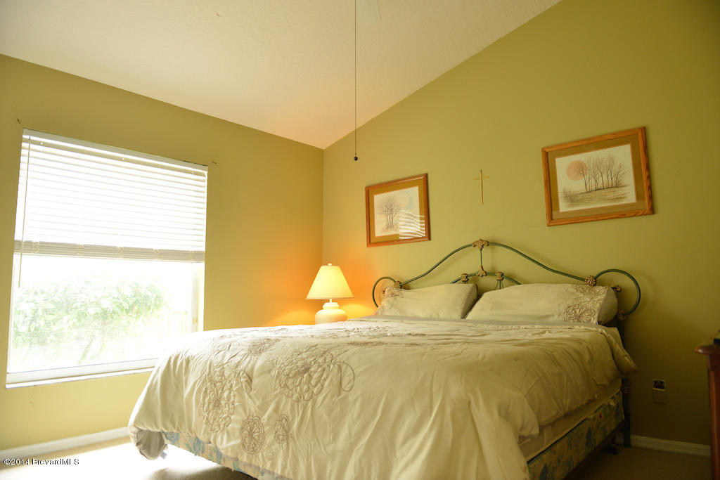 1706 Rustic Way Melbourne, FL 32935 - Photo 13 of 16 Second bedroom vaulted ceiling