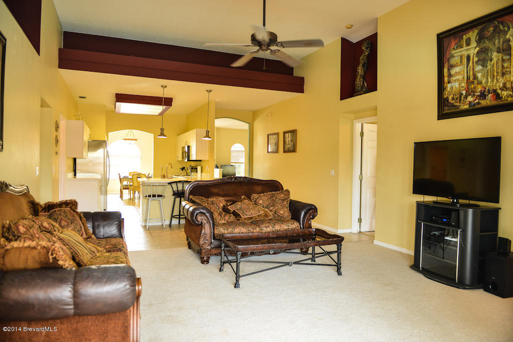 1706 Rustic Way Melbourne, FL 32935 - Photo 5 of 16 Family Room with cathedral ceiling