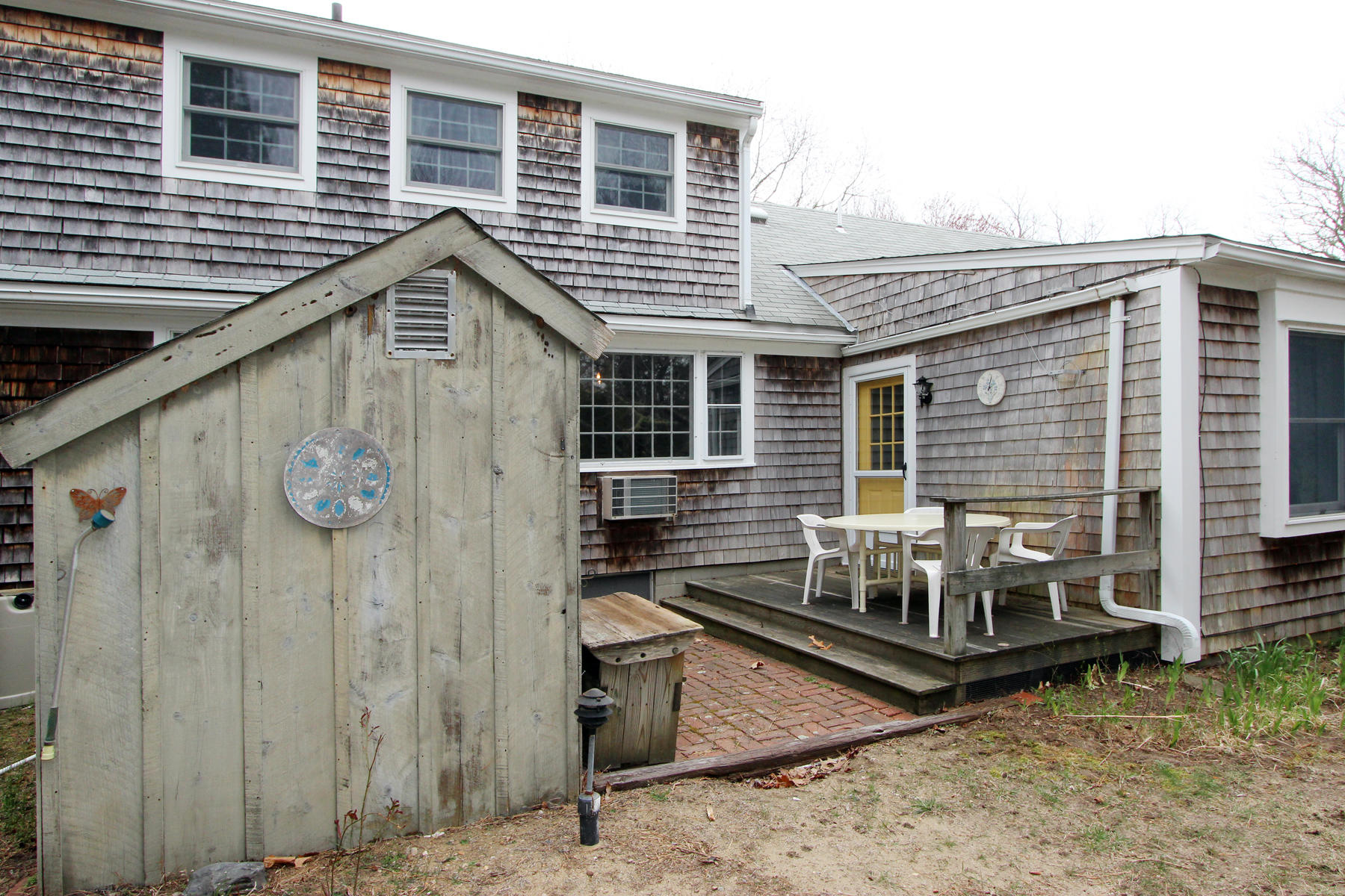 75 Lawton Road Eastham, MA 02642 - Photo 26 of 27 a view of house with chair and tables