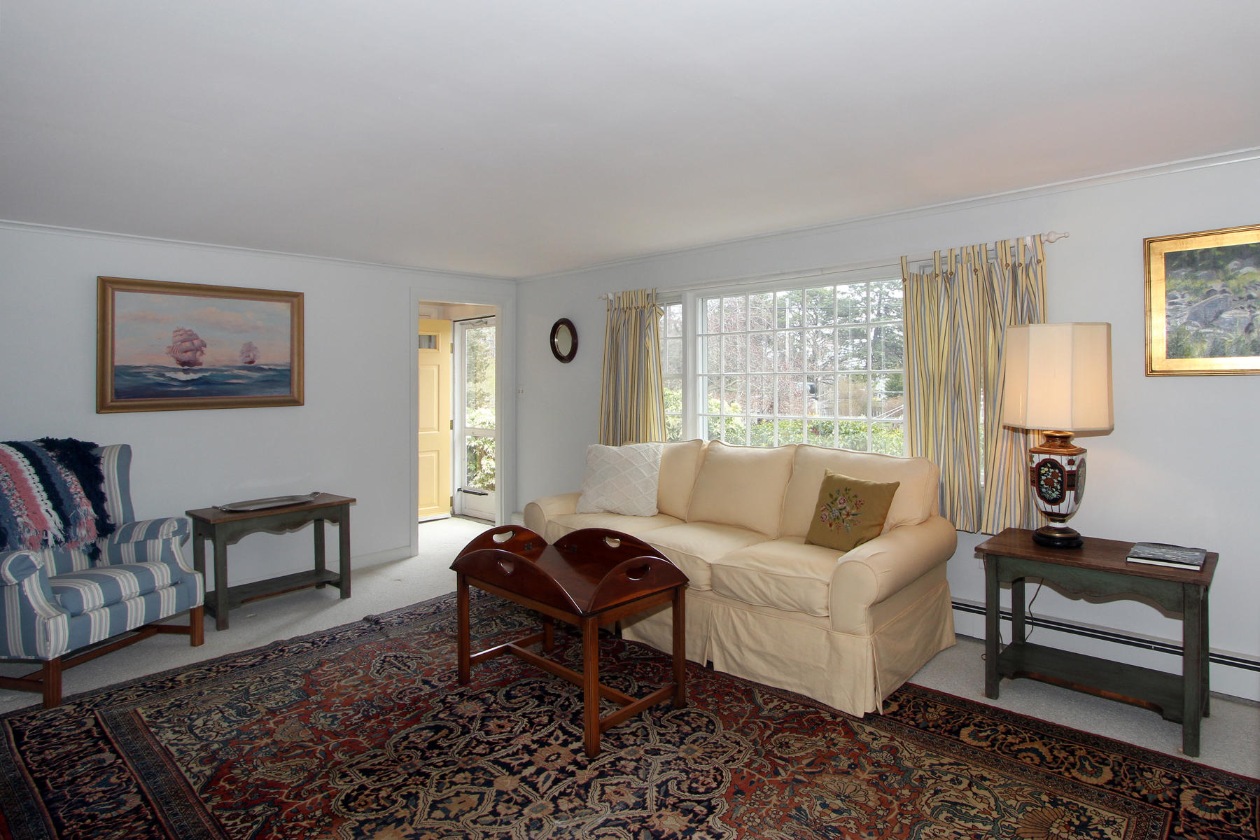 75 Lawton Road Eastham, MA 02642 - Photo 6 of 27 a living room with furniture and a window