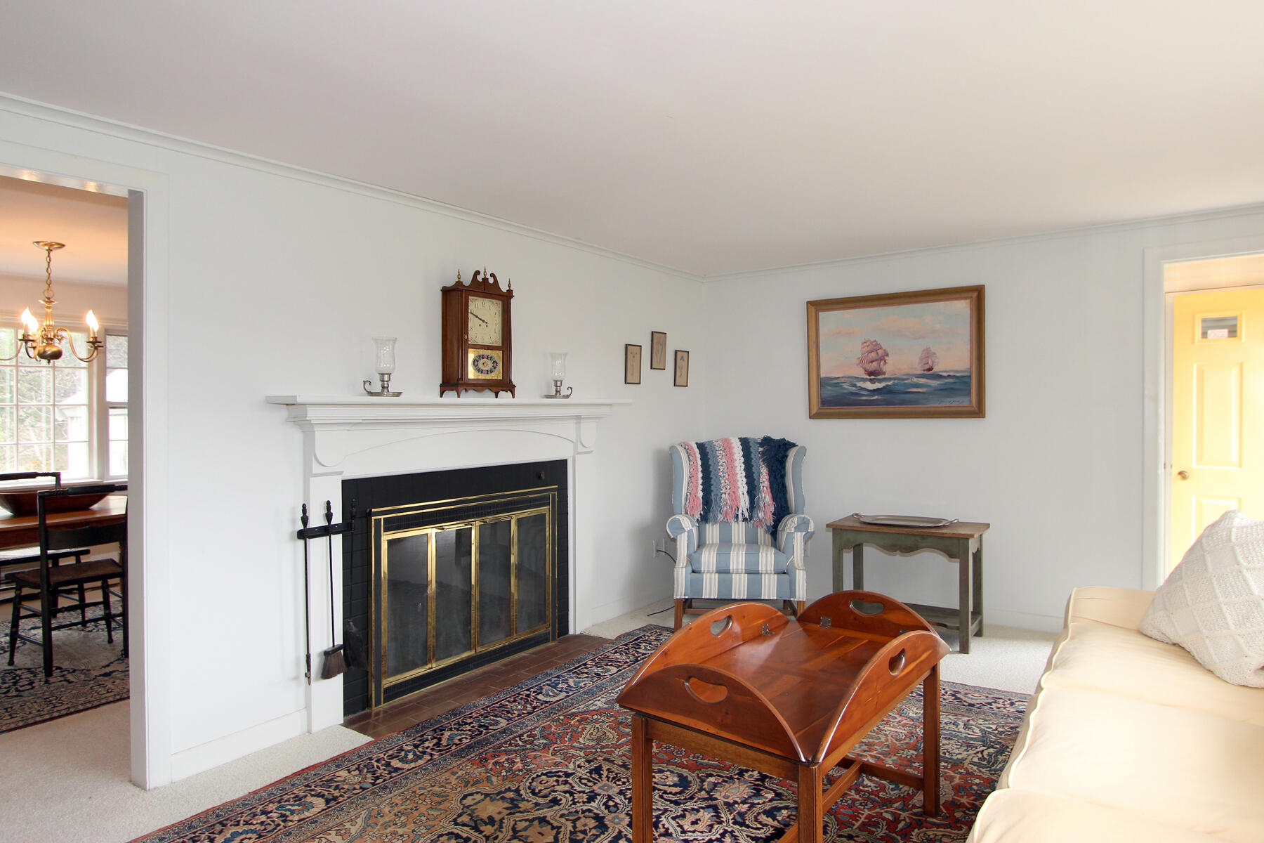 75 Lawton Road Eastham, MA 02642 - Photo 7 of 27 a living room with furniture a window and a fireplace