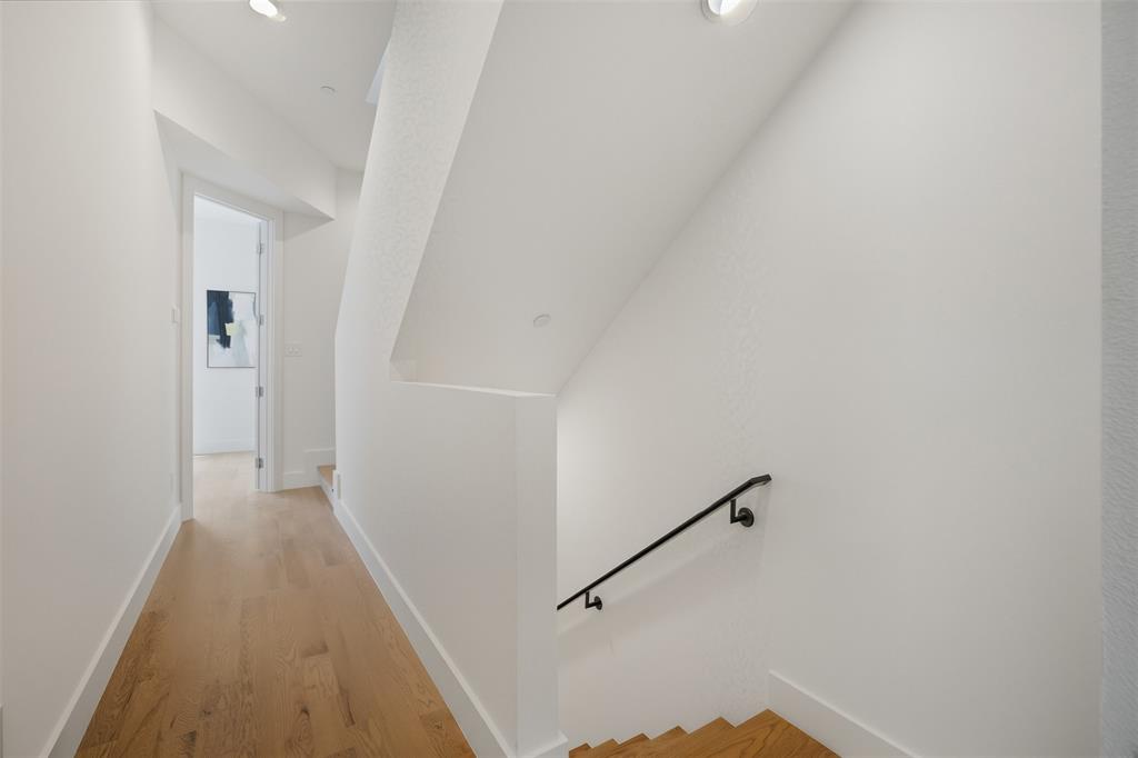 4517 Munger Avenue, Unit 101 Dallas, TX 75204 - Photo 20 of 39 a view of a hallway with staircase