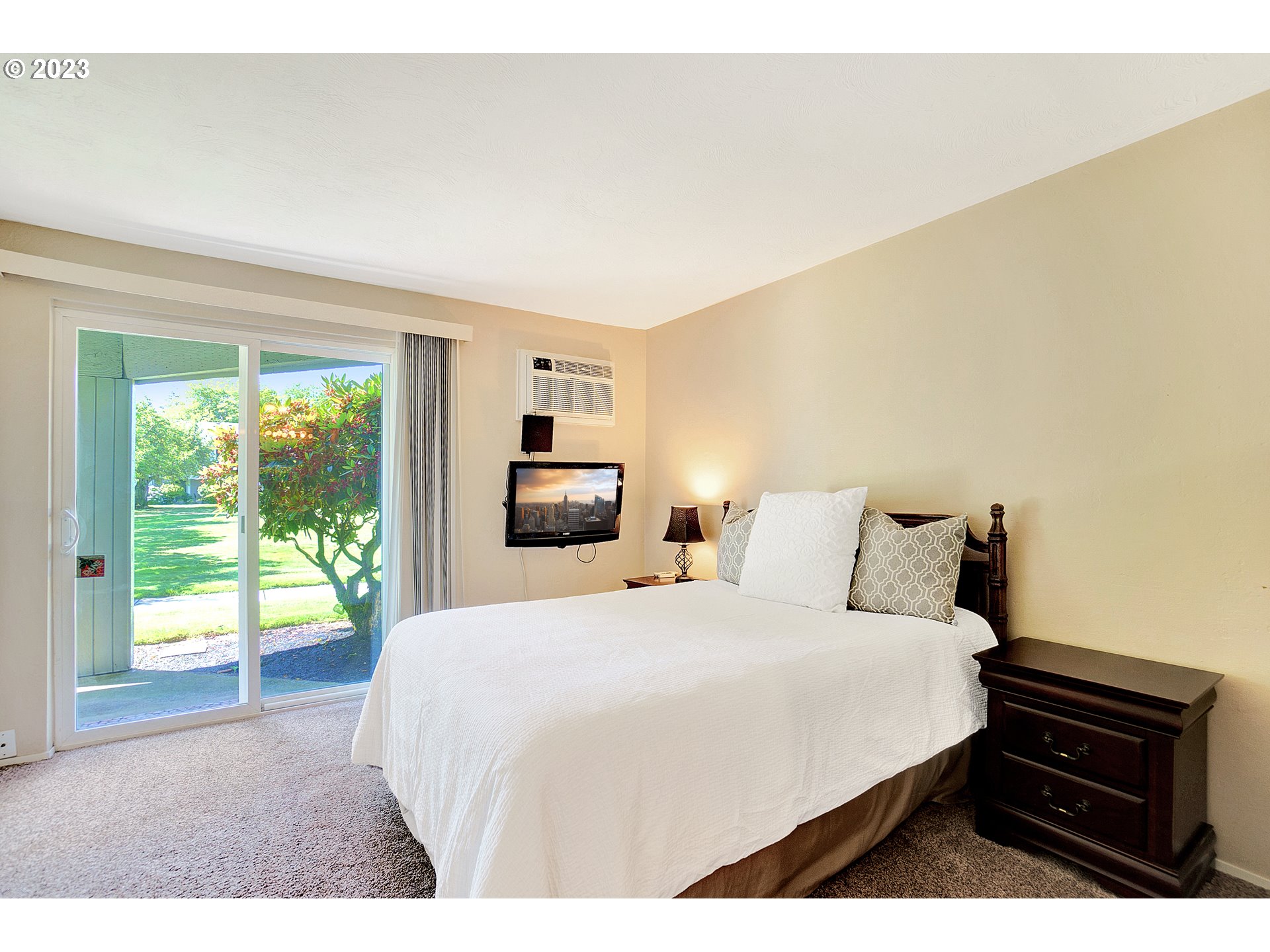 650 Harlow Road, Unit 132 Springfield, OR 97477 - Photo 13 of 36 a bedroom with a bed and a tv