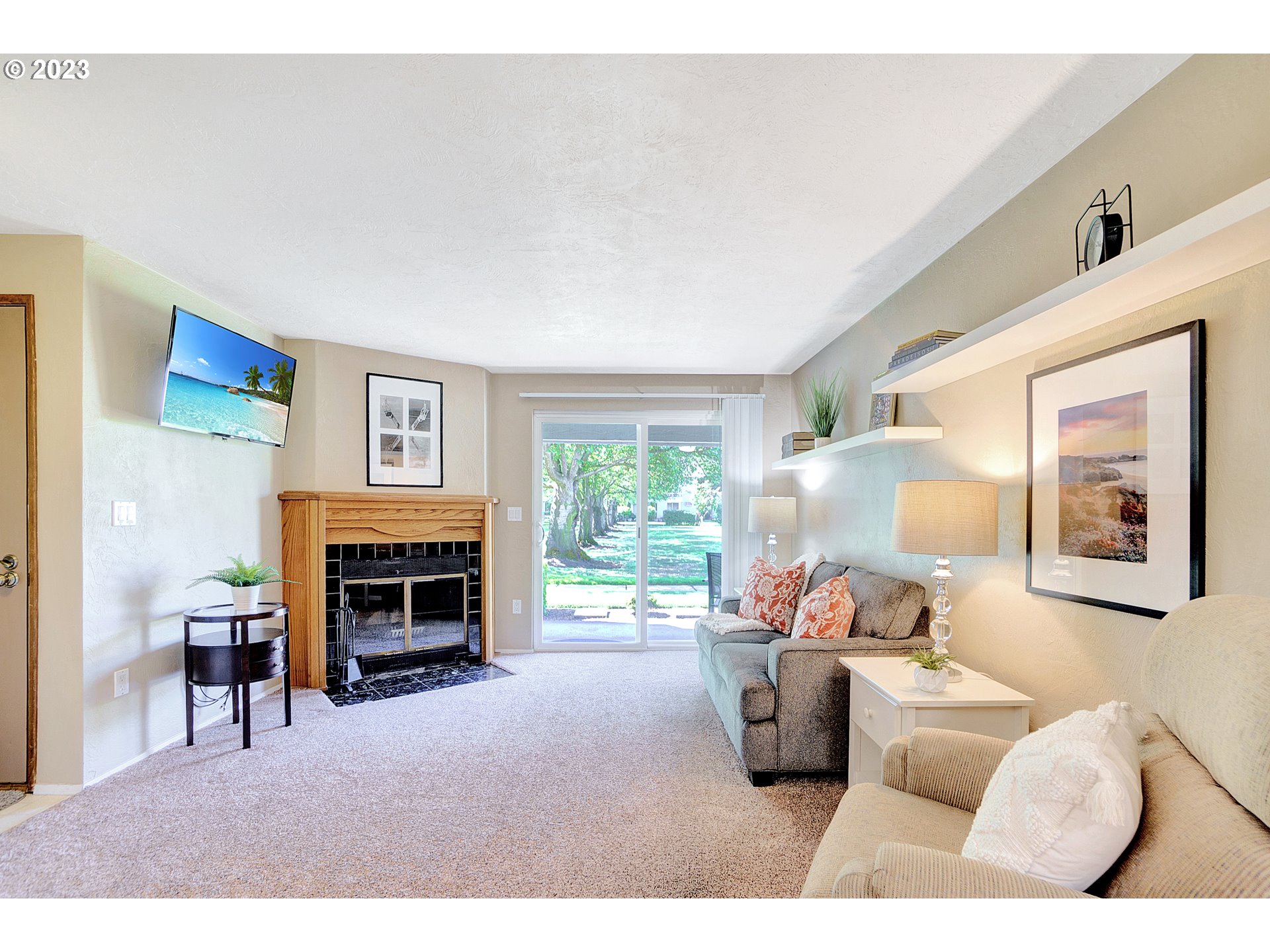 650 Harlow Road, Unit 132 Springfield, OR 97477 - Photo 2 of 36 a living room with furniture a fireplace and a large window