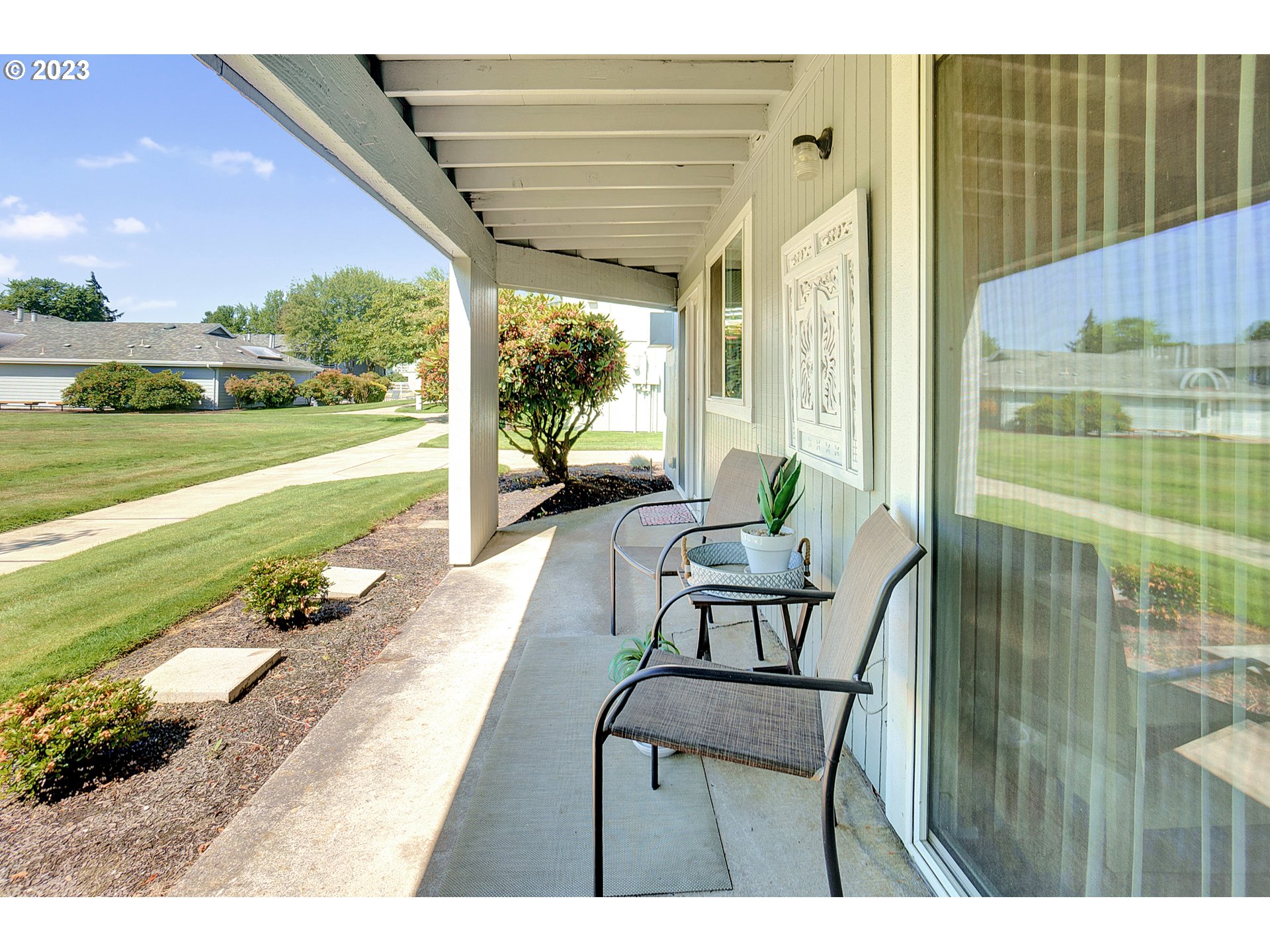 650 Harlow Road, Unit 132 Springfield, OR 97477 - Photo 22 of 36 a balcony with wooden floor and outdoor seating
