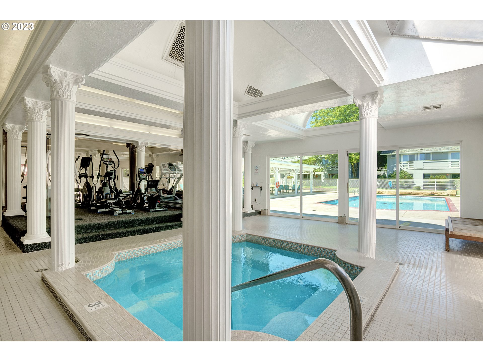 650 Harlow Road, Unit 132 Springfield, OR 97477 - Photo 25 of 36 a view of a living room and a floor to ceiling window wooden floor