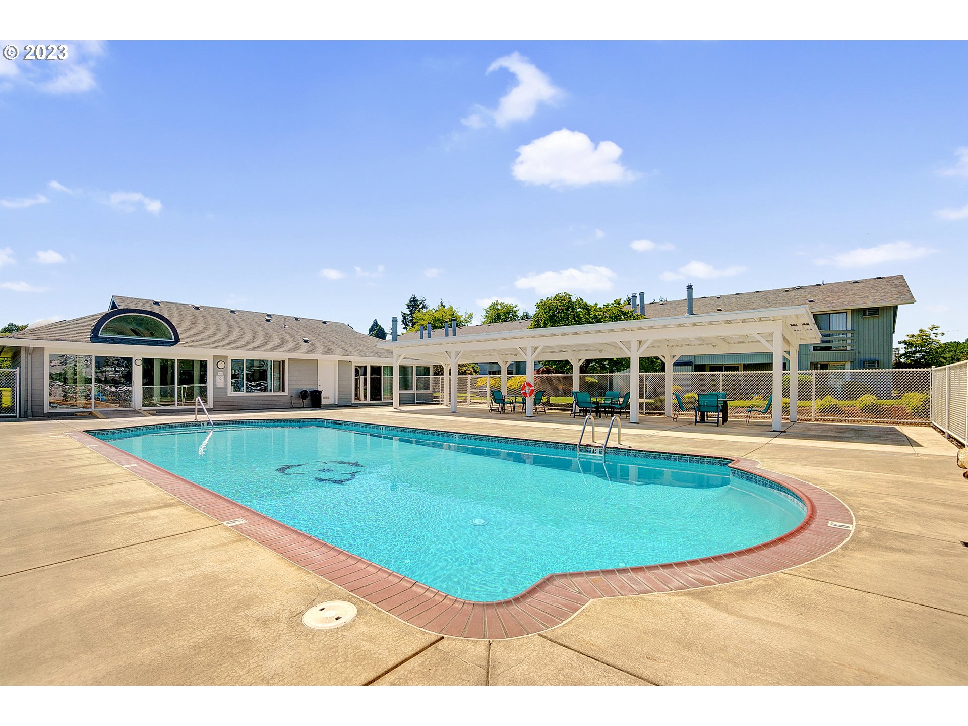 650 Harlow Road, Unit 132 Springfield, OR 97477 - Photo 29 of 36 a view of a house with pool fire pit a barbeque grill and a fireplace