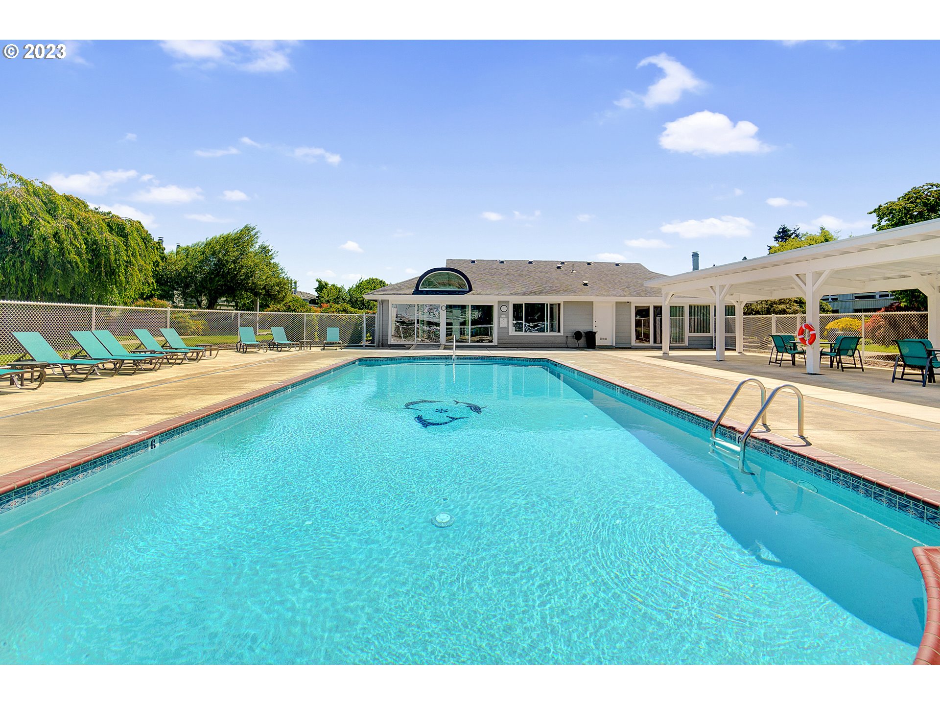 650 Harlow Road, Unit 132 Springfield, OR 97477 - Photo 30 of 36 a swimming pool with outdoor seating and yard