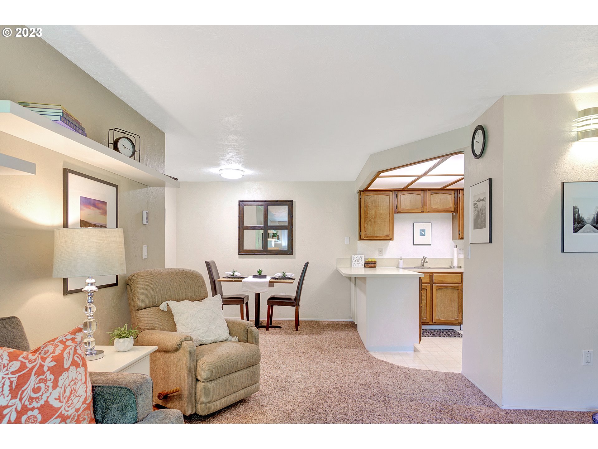 650 Harlow Road, Unit 132 Springfield, OR 97477 - Photo 3 of 36 a living room with furniture and view of kitchen
