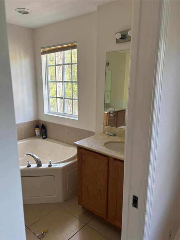 4632 Danson Way Delray Beach, FL 33445 - Photo 13 of 26 a bath tub sitting in a bathroom next to a window