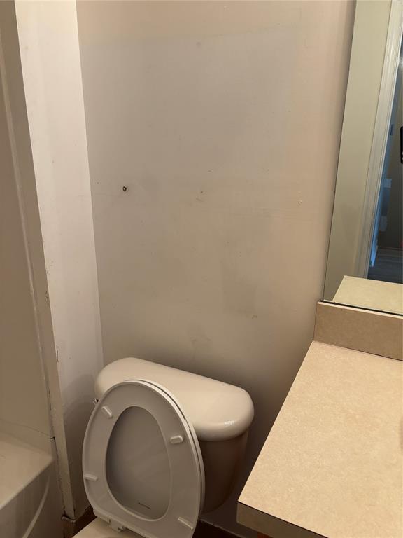 4632 Danson Way Delray Beach, FL 33445 - Photo 16 of 26 a white toilet sitting next to a white tub