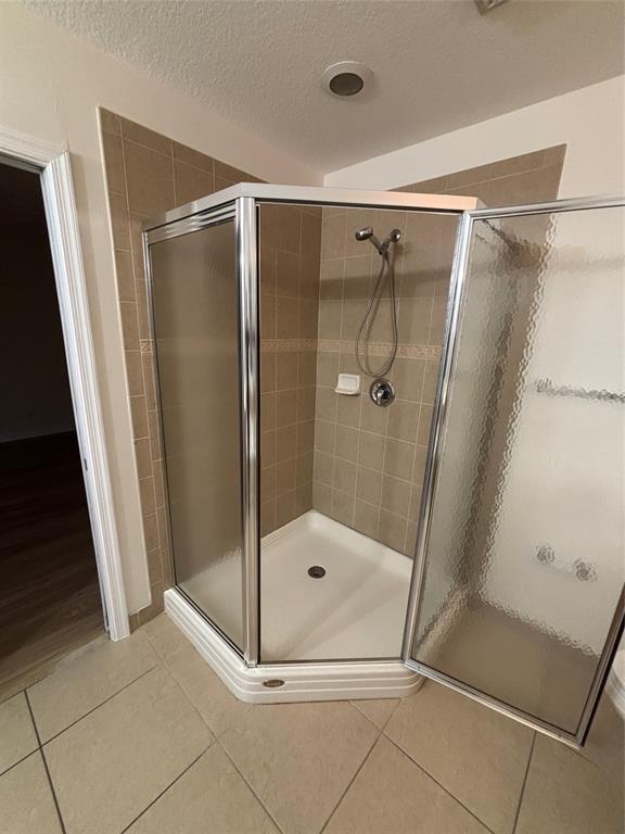 4632 Danson Way Delray Beach, FL 33445 - Photo 21 of 26 a bathroom with a glass door shower and toilet