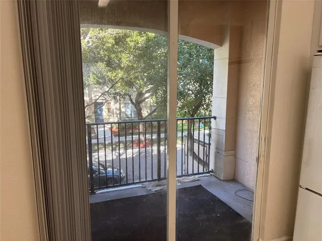 an empty room with wooden floor and closet