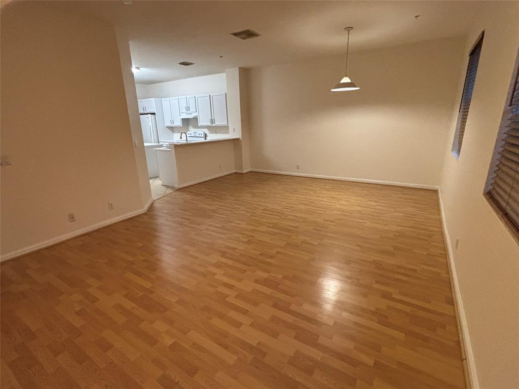 4632 Danson Way Delray Beach, FL 33445 - Photo 7 of 26 an empty room with a kitchen and a sink