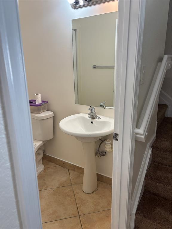 4632 Danson Way Delray Beach, FL 33445 - Photo 9 of 26 a bathroom with a sink toilet and a mirror