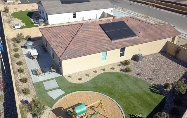 a view of a white house with a outdoor space