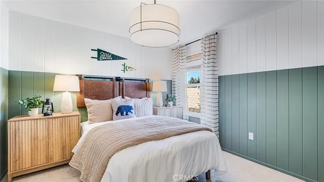 a bed room with a bed and a chandelier