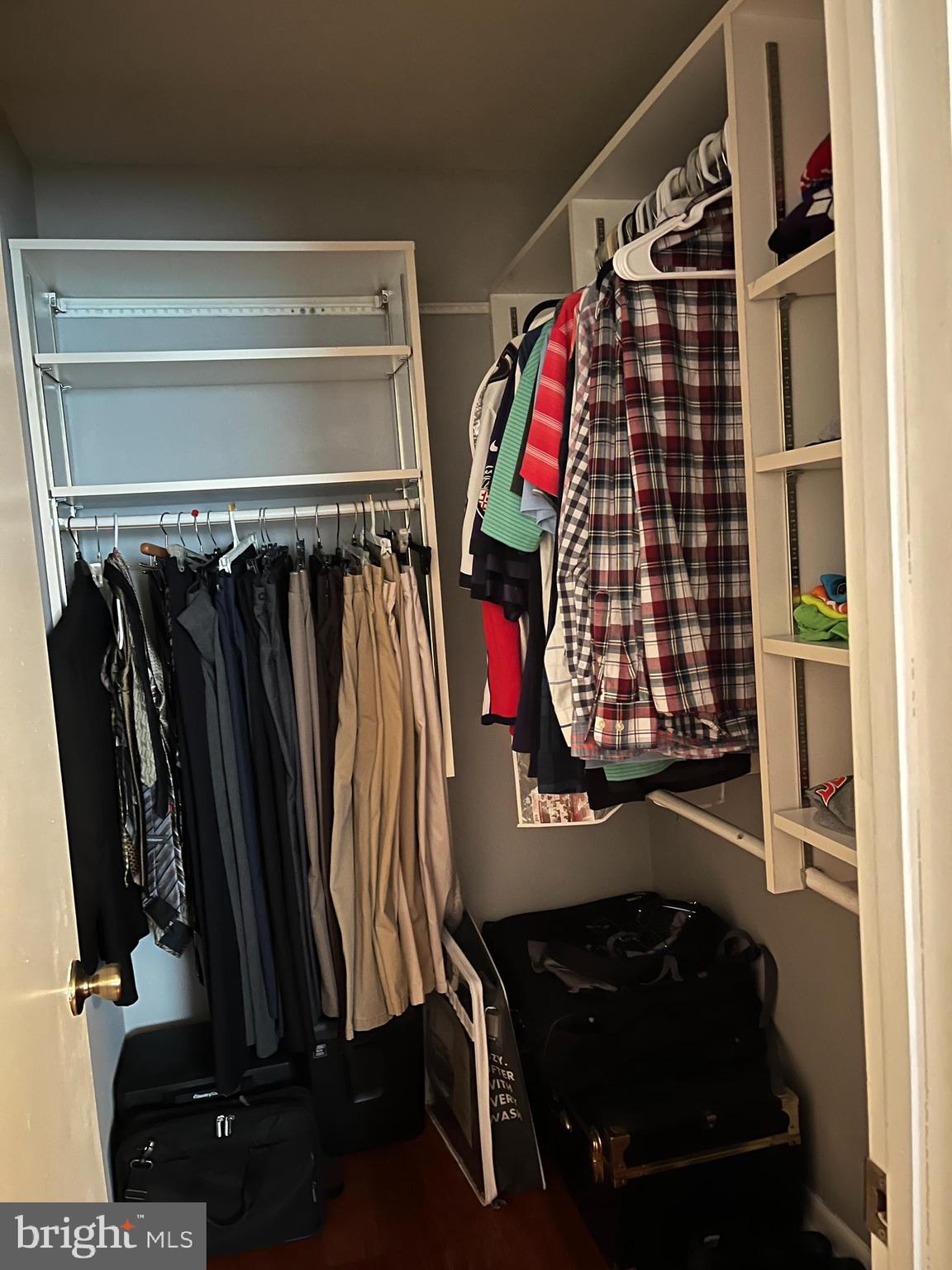 100 Castletown Road, Unit 101 Lutherville-Timonium, MD 21093 - Photo 13 of 18 a view of walk in closet with clothes and shoes